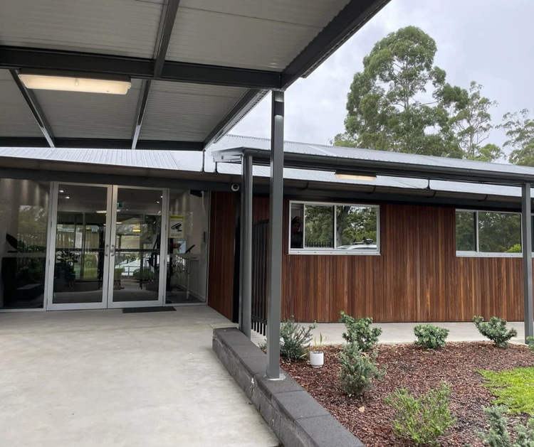 A modern looking front office greets visitors upon entering school grounds.